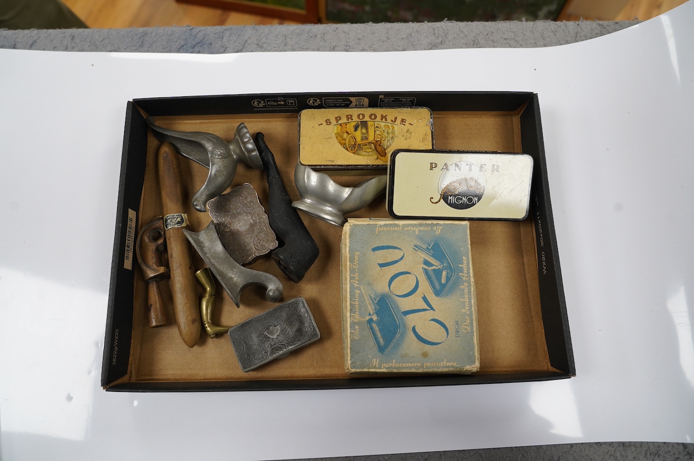 Sundry smoking related curios, including a pipe, pipe stands, match boxes, an ashtray, etc. Condition - fair